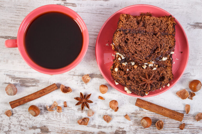 Black coffee, dark cake with chocolate, cocoa and plum jam